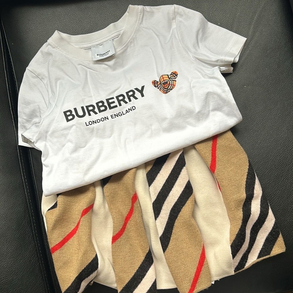 Girls size 4 wool Burberry skirt

Girl size 4 white bear Burberry shirt